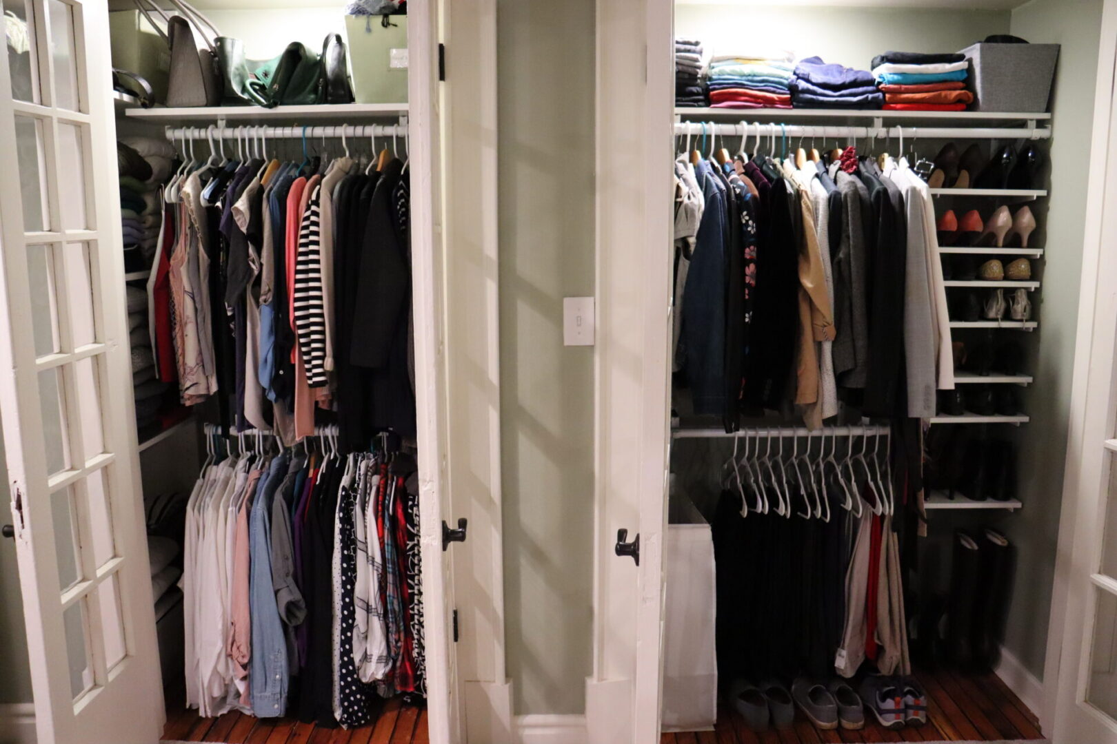 Opened in-wall clothes closet that is organized
