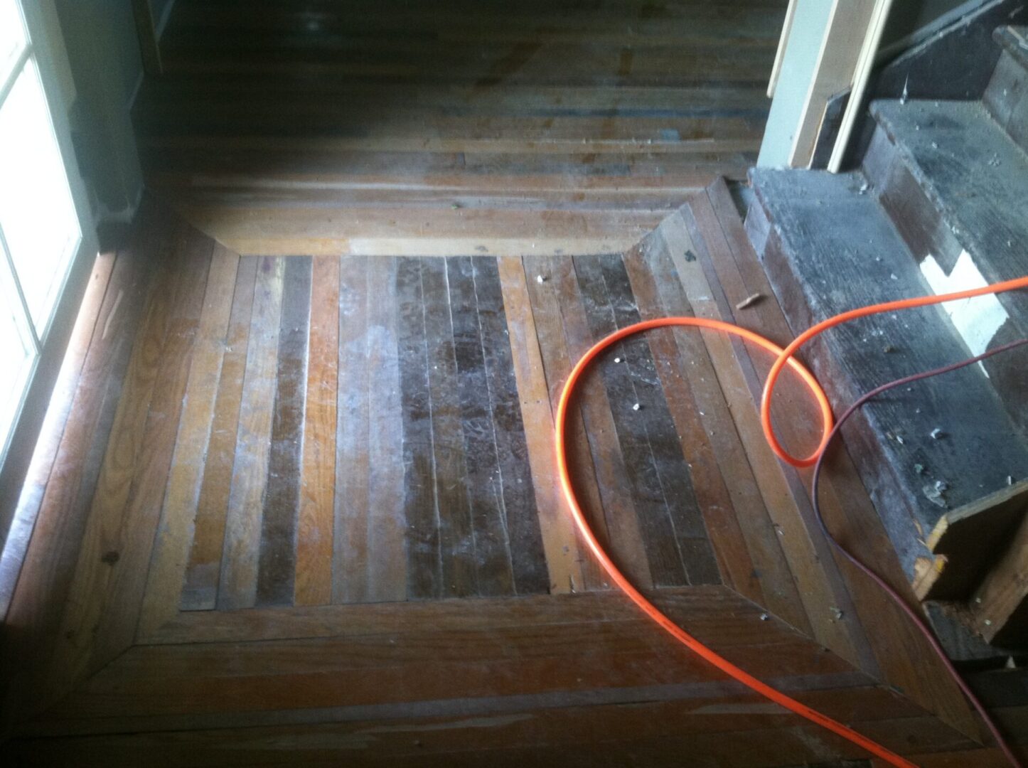 Wood flooring leading up to a staircase