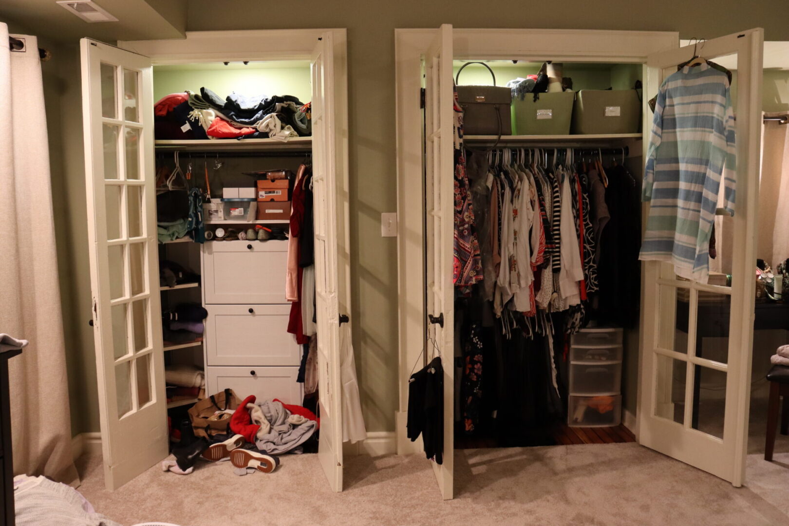 Opened white double doors of two clothes cabinet